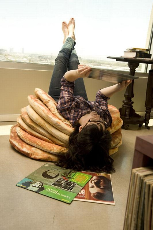 Relaxing with the Pancake Floor Pillows by Todd von Bastiaans.